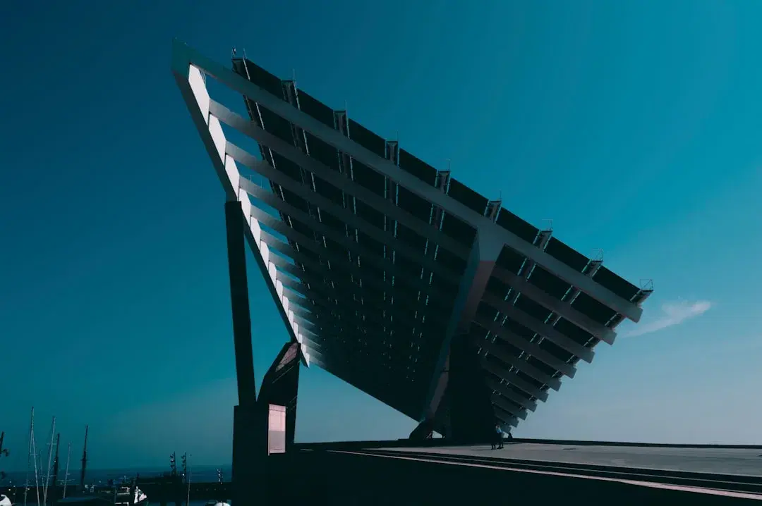 Ground-mounted solar module row at dusk