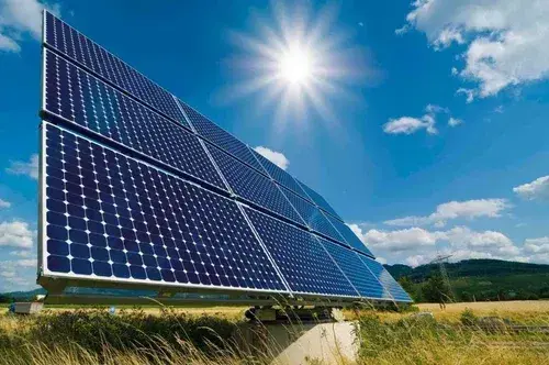Rows of solar photovoltaic panels under a clear sky